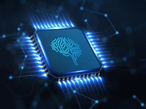 a microchip with a glowing blue outline, featuring a circuit design in the shape of a brain at its center. The chip is surrounded by illuminated connections, giving the impression of data flow or electrical activity. The background is a dark, abstract network pattern, emphasizing the theme of advanced technology and artificial intelligence