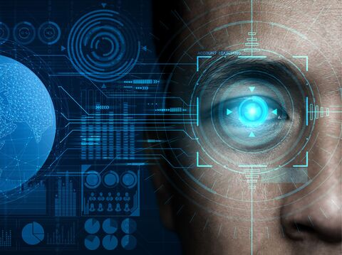 A close-up of a human eye enhanced with futuristic digital overlays, including graphics of the globe, charts, and various data elements in blue tones