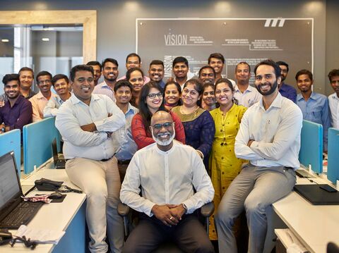 A group of people in an organization posing for a photograph