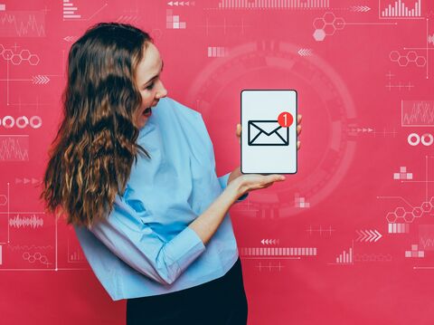 Excited woman reacting to new email on phone