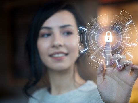 A woman pointing to a digitally designed lock