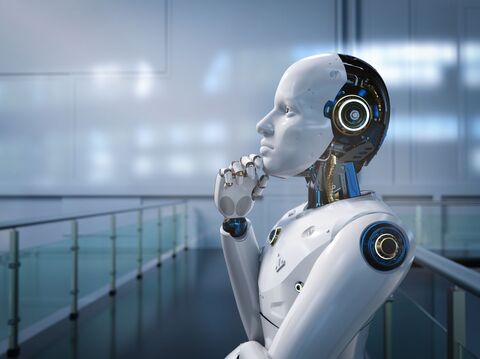 A humanoid robot in a thoughtful pose, representing artificial intelligence and machine learning, with a futuristic, industrial background